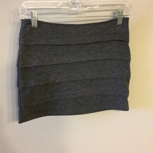Grey mini skirt.